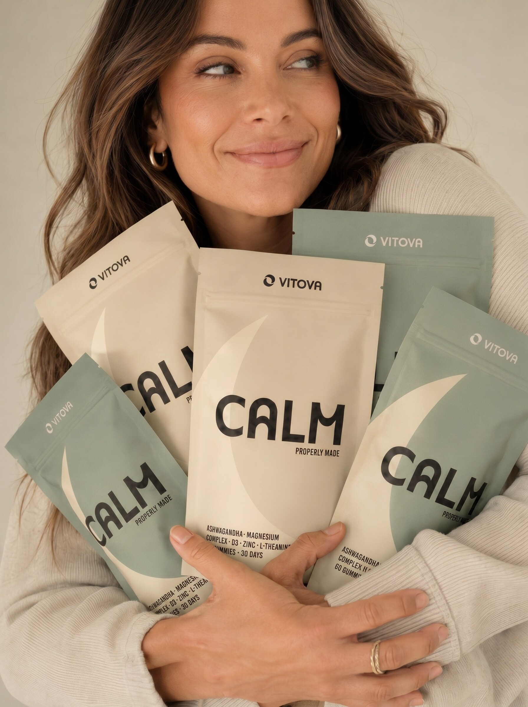 A person holding multiple Vitova Calm pouches